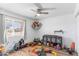 Playful bedroom with bright natural light, wood flooring, and ceiling fan at 2850 E Cortez St, Phoenix, AZ 85028