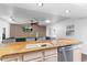 Gourmet kitchen features stainless steel appliances, breakfast bar, and granite countertops at 2850 E Cortez St, Phoenix, AZ 85028