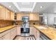 Kitchen featuring stainless steel appliances, granite countertops, and a skylight above at 2850 E Cortez St, Phoenix, AZ 85028