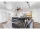 Open living room featuring hardwood floors, a ceiling fan, and open access to the kitchen at 2850 E Cortez St, Phoenix, AZ 85028