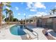 Backyard pool area with a diving board and seating area for outdoor relaxation and enjoyment at 2850 E Cortez St, Phoenix, AZ 85028
