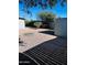 Backyard with shed, gravel, and mature trees at 2853 W Ohio St, Apache Junction, AZ 85120