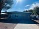 Gray house with carport and a spacious yard at 2853 W Ohio St, Apache Junction, AZ 85120