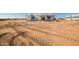 New home construction with tire tracks in the dirt lot at 28551 N 257Th Ave, Wittmann, AZ 85361