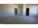 Bright bedroom with tile flooring, awaiting personalization, featuring a closet and ample natural light at 28583 N 257Th Dr, Wittmann, AZ 85361