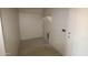 Functional laundry room area with shelf, connections, and tile floors ready for appliances and customization at 28583 N 257Th Dr, Wittmann, AZ 85361