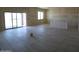 Bright living room featuring sliding glass doors to the back, and tiled flooring at 28583 N 257Th Dr, Wittmann, AZ 85361