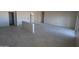 Open-concept living space featuring stylish tile floors and convenient electrical outlets along the walls at 28583 N 257Th Dr, Wittmann, AZ 85361