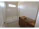 Bathroom with a shower/tub combo and unfinished cabinets at 28615 N 257Th Dr, Wittmann, AZ 85361