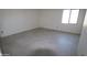 Bright bedroom with a window and tile flooring at 28615 N 257Th Dr, Wittmann, AZ 85361