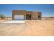 Contemporary single-story home featuring a neutral palette and eye-catching stone accents at 28615 N 257Th Dr, Wittmann, AZ 85361