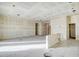 Unfinished kitchen with tile flooring and island at 28615 N 257Th Dr, Wittmann, AZ 85361