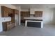 Spacious kitchen with custom wood cabinets and a large center island at 28615 N 257Th Dr, Wittmann, AZ 85361