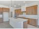 Bright kitchen featuring shaker cabinets, quartz countertops, and stainless steel appliances at 28615 N 257Th Dr, Wittmann, AZ 85361