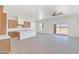 Open concept kitchen with shaker cabinets, large island, and stainless steel appliances at 28615 N 257Th Dr, Wittmann, AZ 85361