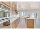 Open concept kitchen with stainless steel appliances, quartz countertops and shaker cabinets at 28615 N 257Th Dr, Wittmann, AZ 85361