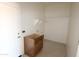 Functional laundry room area with cabinetry, shelving, and space for appliances at 28615 N 257Th Dr, Wittmann, AZ 85361