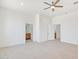 Spacious main bedroom showing entryways into bathrooms on both sides, tile flooring throughout at 28615 N 257Th Dr, Wittmann, AZ 85361