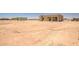 Expansive view of the property with a custom home, perfect for outdoor activities at 28615 N 257Th Dr, Wittmann, AZ 85361