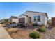 One story home with brown garage door and front yard landscaping at 3341 E Rebel Ln, San Tan Valley, AZ 85143