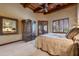 Bedroom with walk in closet and wood accents at 3461 N Ladera Cir, Mesa, AZ 85207