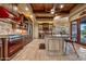 Gourmet kitchen with red range, island, and wood cabinetry at 3461 N Ladera Cir, Mesa, AZ 85207