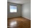 Bright bedroom with wood-look floors and window coverings at 3506 W Yucca St, Phoenix, AZ 85029