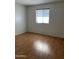 Bright bedroom with wood-look floors and window coverings at 3506 W Yucca St, Phoenix, AZ 85029