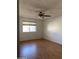 Bright bedroom with hardwood floors and a window with blinds at 3506 W Yucca St, Phoenix, AZ 85029
