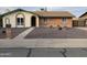 Brick ranch style home with small front yard and walkway at 3506 W Yucca St, Phoenix, AZ 85029