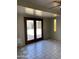 Gathering room with tile floors and sliding doors leading to the pool at 3506 W Yucca St, Phoenix, AZ 85029