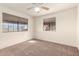 Well-lit bedroom with ceiling fan and window coverings at 3535 W Monte Cristo Ave # 101, Phoenix, AZ 85053