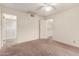 Bright bedroom with access to a bathroom and ceiling fan at 3535 W Monte Cristo Ave # 101, Phoenix, AZ 85053