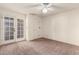 Spacious bedroom with double doors and ceiling fan at 3535 W Monte Cristo Ave # 101, Phoenix, AZ 85053