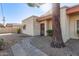 Front entrance of condo with walkway and mature tree at 3535 W Monte Cristo Ave # 101, Phoenix, AZ 85053