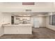 Open kitchen with breakfast bar and view into living area at 3535 W Monte Cristo Ave # 101, Phoenix, AZ 85053