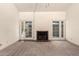 Bright living room featuring a fireplace and sliding glass doors leading to a patio at 3535 W Monte Cristo Ave # 101, Phoenix, AZ 85053