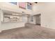 Spacious living room with high ceilings, fireplace, and kitchen access at 3535 W Monte Cristo Ave # 101, Phoenix, AZ 85053