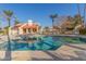 Community pool with surrounding patio furniture and palm trees at 3535 W Monte Cristo Ave # 101, Phoenix, AZ 85053