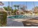 Inviting community pool with lounge chairs and lush landscaping at 3535 W Monte Cristo Ave # 101, Phoenix, AZ 85053