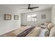 Main bedroom with window, chair and ceiling fan at 3701 W Evans Dr, Phoenix, AZ 85053