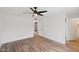 Bedroom with wood-look floors and ceiling fan at 3701 W Evans Dr, Phoenix, AZ 85053