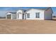 New construction home with a two-car garage and desert landscaping at 37144 W Encinas Ln, Tonopah, AZ 85354