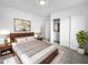 Spacious bedroom with wood bed frame and ample closet space at 40551 N Jodi Dr, San Tan Valley, AZ 85140
