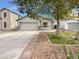 Single-story house with a two-car garage and landscaped front yard at 40551 N Jodi Dr, San Tan Valley, AZ 85140