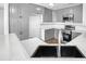 Modern kitchen with gray cabinets and stainless steel appliances at 40551 N Jodi Dr, San Tan Valley, AZ 85140