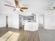 Open living room with hardwood floors and kitchen island at 40551 N Jodi Dr, San Tan Valley, AZ 85140