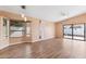 Living room with wood-look floors and sliding glass doors at 413 W Beverly Ln, Phoenix, AZ 85023