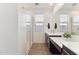Modern bathroom featuring a glass-enclosed shower, dual vanities, and a large mirror at 4342 E Enmark Dr, San Tan Valley, AZ 85143
