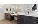 Modern bathroom featuring dual vanities, lots of counter space and a large mirror and walk-in shower at 4342 E Enmark Dr, San Tan Valley, AZ 85143
